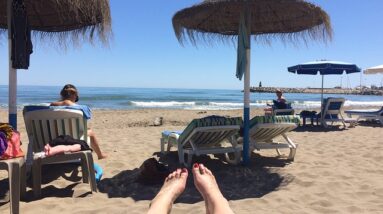 Person being successful working from home online while at the beach.