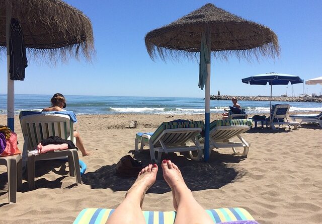 Person being successful working from home online while at the beach.