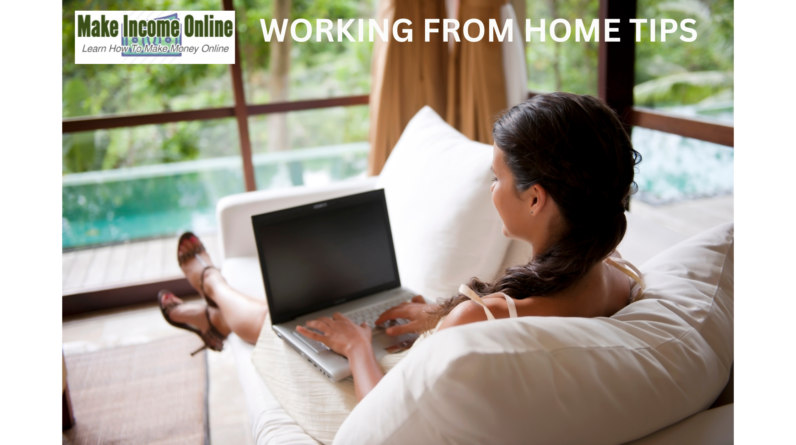 A woman working from home on her computer in a cozy home office.