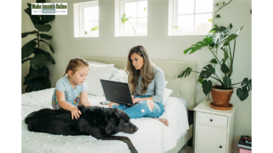 Woman working from home with her child and dog by her side, balancing family life and career."