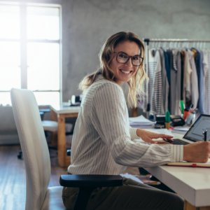 A woman working from home at her desk, representing Amazon work from home jobs in 2024."